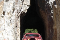 Chuck & Eva Cochren going through the needle on Needles Highway in the Black Hills. He had to wait for a bus coming the other way. The bus was about dragging the sides coming through and he was creeping along.