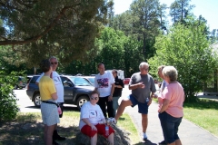 Part of the group are pausing at the Devils Tower parking lot